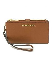 Michael Kors Skórzany portfel w kolorze karmelowym - 19 x 14 x 2 cm rozmiar: onesize. Brązowe portfele Michael Kors, bez wzorów, z materiału. Za 567.00 zł.