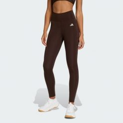 Długie legginsy Optimé Essentials Stash Pocket. Brązowe legginsy adidas, bez wzorów, długie. Za 230.00 zł.