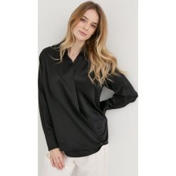 Victoria Beckham bluzka jedwabna damska kolor czarny gładka. Czarne bluzki VICTORIA BECKHAM, bez wzorów, z jedwabiu, bez kołnierzyka, bez ramiączek. W wyprzedaży za 1,399.90 zł.