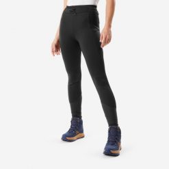 Legginsy turystyczne damskie Quechua NH500 Warm. Czarne legginsy QUECHUA, bez wzorów, z materiału, sportowe. Za 199.99 zł.