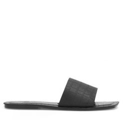 Klapki JENNY. Czarne klapki Jenny, bez wzorów, bez obcasa, bez zapięcia. Za 39.99 zł.