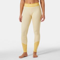 Damskie legginsy z merynosów Helly Hansen Lifa. Żółte legginsy Helly Hansen, bez wzorów, z wełny, sportowe. Za 369.50 zł.