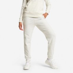 Spodnie dresowe damskie. Szare spodnie dresowe DOMYOS, bez wzorów, z bawełny, na jogę i pilates. Za 99.99 zł.