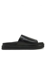 Calvin Klein Jeans Klapki Flat Molded Sandal Slide YW0YW01710 Czarny. Czarne klapki Calvin Klein Jeans, bez wzorów, z jeansu, bez obcasa, bez zapięcia. Za 439.99 zł.