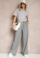 Szare Materiałowe Spodnie z Szerokimi Nogawkami High Waist z Gumką w Talii Comina. Szare jeansy Renee, bez wzorów, z jeansu, eleganckie, z podwyższonym stanem. W wyprzedaży za 111.99 zł.
