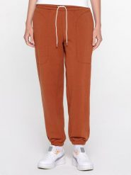 Puma Spodnie dresowe "Infuse" w kolorze jasnobrązowym rozmiar: M. Brązowe spodnie dresowe Puma, bez wzorów, z dresówki. Za 140.20 zł.