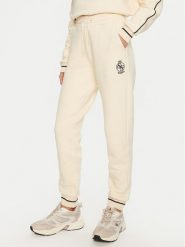 Guess Spodnie dresowe Nia V4BB06 KCHU1 Beżowy Regular Fit. Brązowe spodnie dresowe Guess, z aplikacjami, z bawełny. Za 379.99 zł.