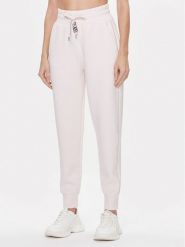 Guess Spodnie dresowe Logo W4RB46 KBYE2 Różowy Regular Fit. Czerwone spodnie dresowe Guess, z aplikacjami, z dresówki. Za 189.99 zł.