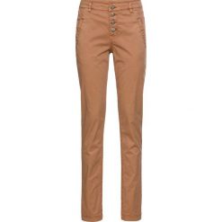 Spodnie chino ze stretchem bonprix jasny koniakowy. Chinosy marki Nike. Za 79.99 zł.