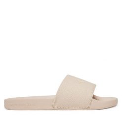 Klapki Calvin Klein Jeans. Brązowe klapki Calvin Klein Jeans, bez wzorów, z jeansu, bez obcasa, bez zapięcia. Za 109.99 zł.