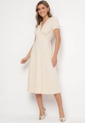Jasnobeżowa Sukienka Rozkloszowana z Wiskozą z Poduszkami w Ramionach Awerla. Brązowe sukienki Born2be, na co dzień, l, bez wzorów, z wiskozy, eleganckie, bez kołnierzyka, bez ramiączek, midi, rozkloszowane. W wyprzedaży za 118.99 zł.