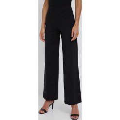 Drykorn spodnie Before damskie kolor czarny szerokie high waist. Czarne spodnie materiałowe DRYKORN, bez wzorów, z materiału, z podwyższonym stanem. W wyprzedaży za 379.99 zł.