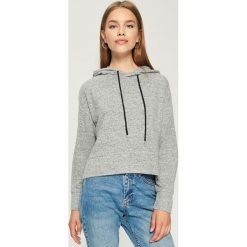 Krótka bluza z kapturem - Jasny szar. Bluzy marki DOMYOS. W wyprzedaży za 29.99 zł.