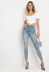 Niebieskie Jeansy Skinny z Postrzępionymi Nogawkami Odettema. Niebieskie jeansy Born2be, bez wzorów, z jeansu, eleganckie. W wyprzedaży za 93.49 zł.