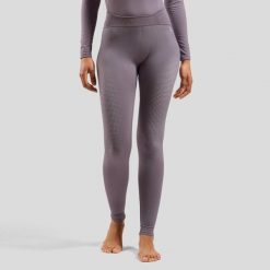 Spodnie termoaktywne damskie ODLO Performance Warm Bl Bottom Long. Fioletowe spodnie narciarskie ODLO, bez wzorów, z elastanu, narciarskie. Za 309.99 zł.
