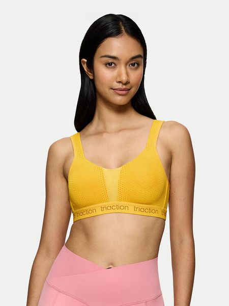 Triumph Biustonosz sportowy Triaction Energy Lite 10201677 Żółty. Żółte biustonosze sportowe Triumph, bez wzorów, z syntetyku. Za 100.00 zł.
