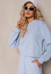 Jasnoniebieska Oversize Bluza z Bawełny o Krótkim Fasonie Sibolla. Niebieskie bluzy Renee, l, bez wzorów, z bawełny, bez kaptura. W wyprzedaży za 83.99 zł.