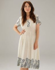 Beżowa sukienka w kwiaty. Brązowe sukienki Unisono, l, bez wzorów, z wiskozy, bez kołnierzyka, bez ramiączek, mini, rozkloszowane. Za 149.00 zł.