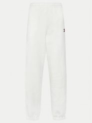 Tommy Jeans Spodnie dresowe Badge DW0DW20679 Écru Regular Fit. Spodnie dresowe Tommy Jeans, bez wzorów, z bawełny. Za 249.99 zł.