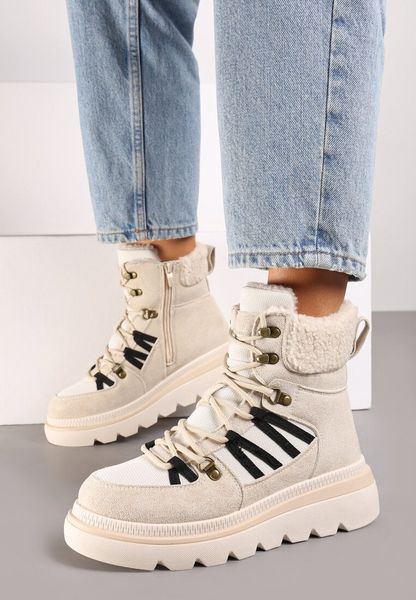 Beżowe Traperki na Grubej Podeszwie Ozdobione Futerkiem Linthira. Brązowe traperki Born2be, bez wzorów, z futra, eleganckie, bez obcasa, bez zapięcia. Za 99.99 zł.