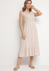Beżowa Wiskozowa Sukienka o Kopertowym Kroju z Falbanką Uliria. Brązowe sukienki Born2be, na spotkanie biznesowe, l, bez wzorów, z wiskozy, eleganckie, bez kołnierzyka, bez ramiączek, midi, kopertowe. Za 89.99 zł.