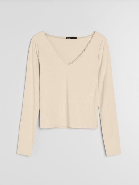 Bluzka z długim rękawem i koronką przy dekolcie - żółty. Żółte bluzki Sinsay, l, bez wzorów, z koronki, bez kołnierzyka, bez ramiączek. Za 25.99 zł.