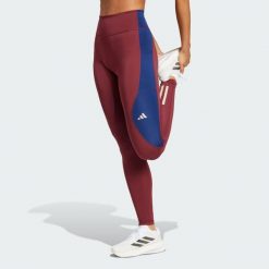 Legginsy Own The Run Colorblock Full-Length. Czerwone bielizna termoaktywna damska adidas, bez wzorów, z materiału, bez ramiączek, do biegania. W wyprzedaży za 216.75 zł.