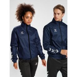 Kurtka ortalionowa piłkarska dla dorosłych Hummel Core XK Spray Jacket. Niebieskie kurtki Hummel, xl, bez wzorów, sportowe, bez kaptura. Za 204.50 zł.