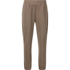 Damskie spodnie dresowe Athlecia Jillnana V2. Brązowe spodnie dresowe Athlecia, bez wzorów, z dresówki. Za 253.00 zł.