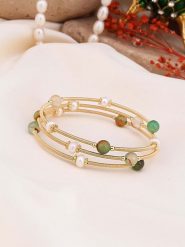 Pierres de Jade Pozłacana bransoletka z perłami i kryształami rozmiar: onesize. Białe bransoletki Pierres de Jade, z kryształem, pozłacane. Za 43.99 zł.