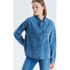 Denimowa koszula - Niebieski. Koszule marki QUECHUA. Za 89.99 zł.