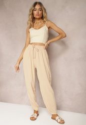 Beżowe Casualowe Spodnie High Waist Wykończone Gumką w Pasie Dimrue. Brązowe jeansy Renee, l, bez wzorów, z jeansu, eleganckie, z podwyższonym stanem. W wyprzedaży za 29.99 zł.