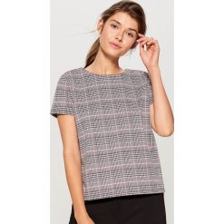 Pudełkowa bluzka w kratkę - Różowy. Bluzki marki DOMYOS. W wyprzedaży za 39.99 zł.