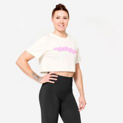 Koszulka fitness damska Domyos crop top. Białe topy DOMYOS, s, bez wzorów, z bawełny, sportowe, bez kołnierzyka, bez ramiączek. W wyprzedaży za 39.99 zł.