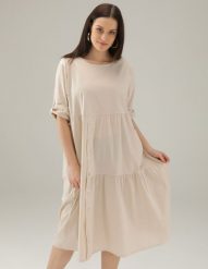 Beżowa sukienka z bawełny. Brązowe sukienki Unisono, m, bez wzorów, z bawełny, bez kołnierzyka, bez ramiączek, midi, rozkloszowane. Za 199.00 zł.