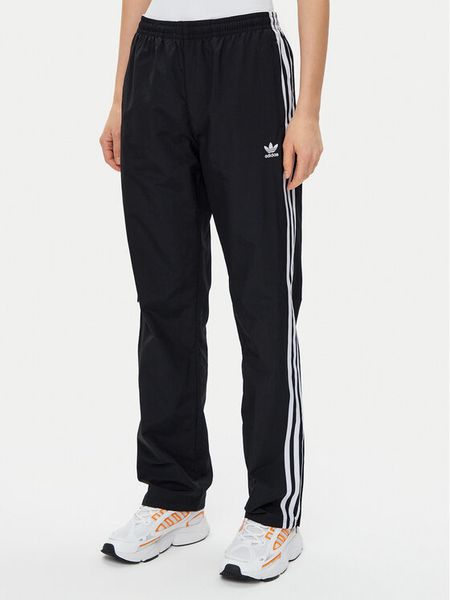 Adidas Spodnie dresowe Woven JD5335 Czarny Loose Fit. Czarne spodnie dresowe adidas, bez wzorów, z dresówki. Za 239.99 zł.