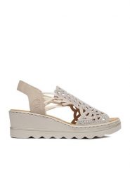 Rieker Sandały CEO-67465-62 Beżowy. Brązowe sandały Rieker, bez wzorów, ze skóry, bez obcasa, na koturnie, bez zapięcia. Za 319.99 zł.