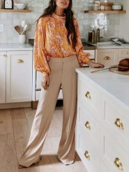 Milan Kiss Bluzka w kolorze żółto-białym rozmiar: XL. Białe bluzki Milan Kiss, xl, bez wzorów, bez kołnierzyka, bez ramiączek. Za 126.99 zł.