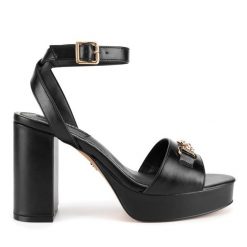 Sandały Nine West. Żółte sandały Nine West, bez wzorów, bez obcasa, na koturnie, bez zapięcia. Za 229.99 zł.