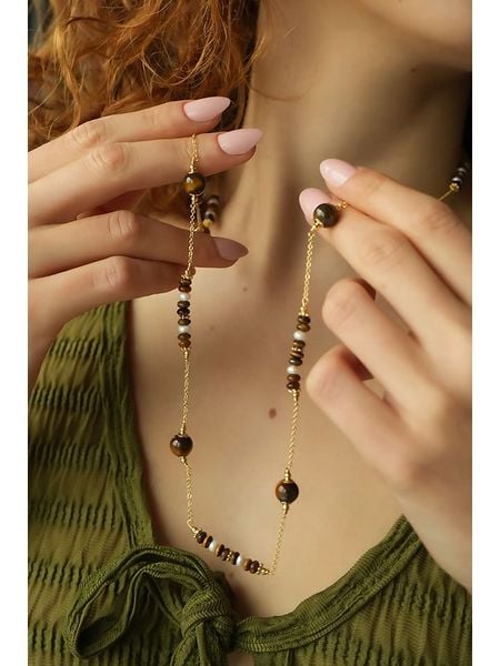 Pierres delicates Pozłacany naszyjnik z tygrysim okiem - dł. 70 cm rozmiar: onesize. Brązowe naszyjniki Pierres delicates, z materiału, pozłacane. Za 65.99 zł.