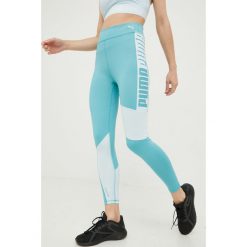 Puma legginsy treningowe Favorite damskie kolor turkusowy z nadrukiem. Niebieskie legginsy Puma, bez wzorów, ze skóry. Za 229.99 zł.