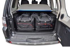 Torby Do Bagażnika Mitsubishi Pajero 5 2006-2017 5Szt Kjust. Czarne torby podróżne KJUST, bez wzorów, z kauczuku. Za 1,586.00 zł.