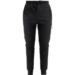 Nike Sportswear TECH PANT Spodnie treningowe black. Czarne spodnie dresowe marki Nike Sportswear, z bawełny. Za 369.00 zł.