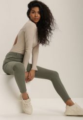 Ciemnozielone Spodnie Skinny Winvienne. Zielone jeansy Renee, m, w ażurowe wzory, z jeansu, z podwyższonym stanem, długie. W wyprzedaży za 55.99 zł.