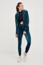 Reebok Classic legginsy damskie kolor zielony gładkie. Zielone legginsy Reebok Classic, bez wzorów, z dzianiny. W wyprzedaży za 159.99 zł.