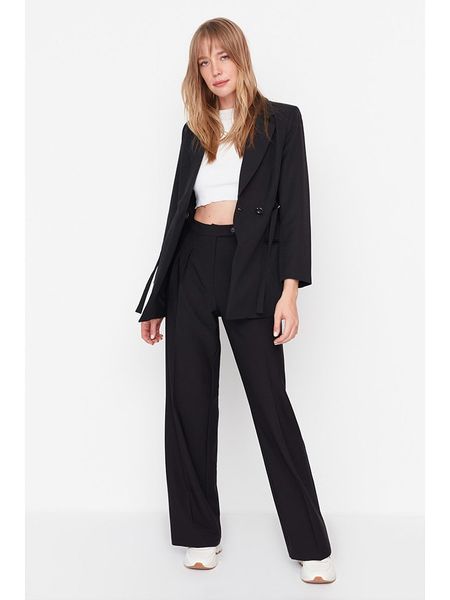 Trendyol Spodnie w kolorze czarnym rozmiar: 34. Czarne spodnie materiałowe Trendyol, bez wzorów, z materiału, z podwyższonym stanem. Za 52.99 zł.