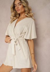 Beżowy Kopertowy Kombinezon z Bawełny Wiązany w Talii Materiałowym Paskiem Vikly. Brązowe kombinezony Renee, na co dzień, l, bez wzorów, z bawełny, eleganckie, bez kołnierzyka, bez ramiączek, kopertowe. W wyprzedaży za 75.99 zł.