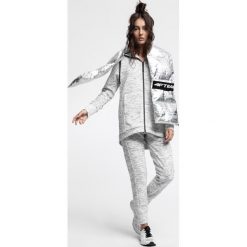 Bluza damska BLD214 - chłodny jasny szary melanż. Bluzy marki DOMYOS. W wyprzedaży za 149.99 zł.