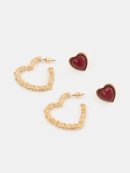 Kolczyki w kształcie serca 2 pack - złoty. Żółte kolczyki Sinsay, złote. Za 15.99 zł.