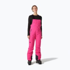 Spodnie narciarskie damskie Helly Hansen Legendary Insulated Bib. Czerwone kombinezony Helly Hansen, na zimę, bez wzorów, sportowe, bez kołnierzyka, bez ramiączek. Za 749.99 zł.
